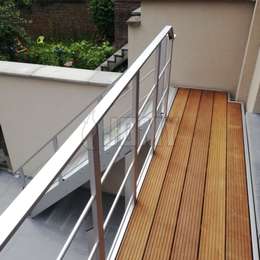 Stairs with a custom-made balcony and hard-wood flooring